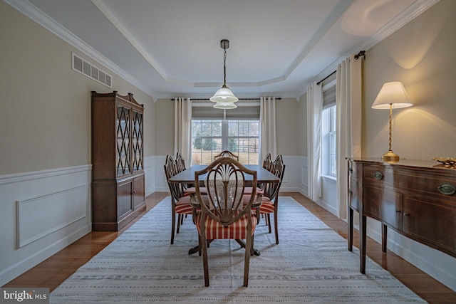 4408 Irish Creek Rd, Bernville, PA 19506 - dining space with a raised ceiling, a wainscoted wall, wood finished floors, and a decorative wall