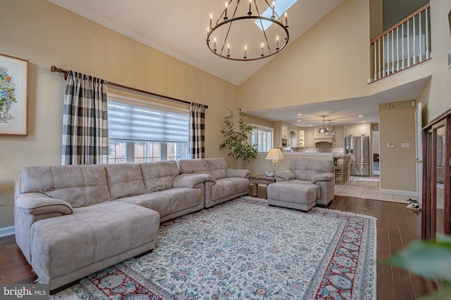 4408 Irish Creek Rd, Bernville, PA 19506 - living room with a chandelier, wood finished floors, baseboards, and high vaulted ceiling