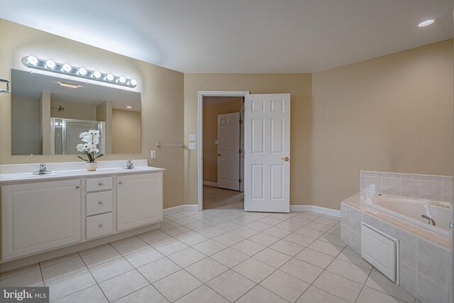 4408 Irish Creek Rd, Bernville, PA 19506 - full bath with tile patterned floors, a garden tub, double vanity, a shower stall, and baseboards