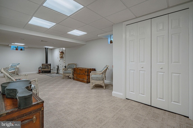 4408 Irish Creek Rd, Bernville, PA 19506 - sitting room featuring a wood stove, carpet flooring, a paneled ceiling, and baseboards