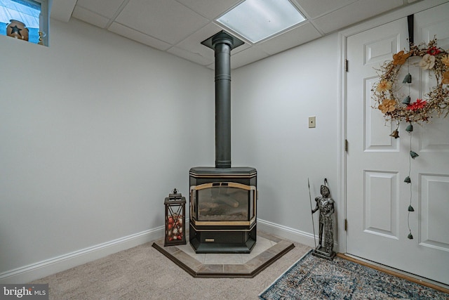 4408 Irish Creek Rd, Bernville, PA 19506 - detailed view of a wood stove, baseboards, carpet, and a drop ceiling