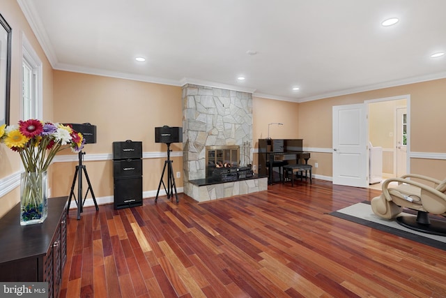 10401 Zion Dr, Fairfax, VA 22032 - living room with wood finished floors, a stone fireplace, recessed lighting, crown molding, and baseboards