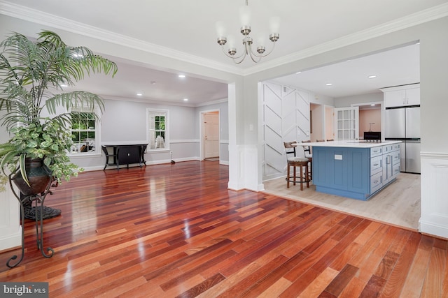 10401 Zion Dr, Fairfax, VA 22032 - living area featuring light wood-type flooring, a chandelier, ornamental molding, and recessed lighting