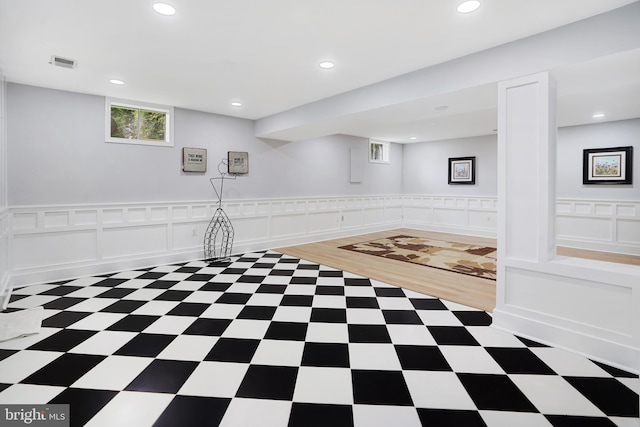 10401 Zion Dr, Fairfax, VA 22032 - below grade area featuring recessed lighting, tile patterned floors, a decorative wall, and a wainscoted wall