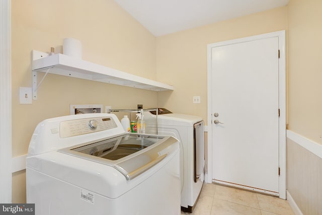 10401 Zion Dr, Fairfax, VA 22032 - laundry area featuring separate washer and dryer, light tile patterned flooring, and baseboards