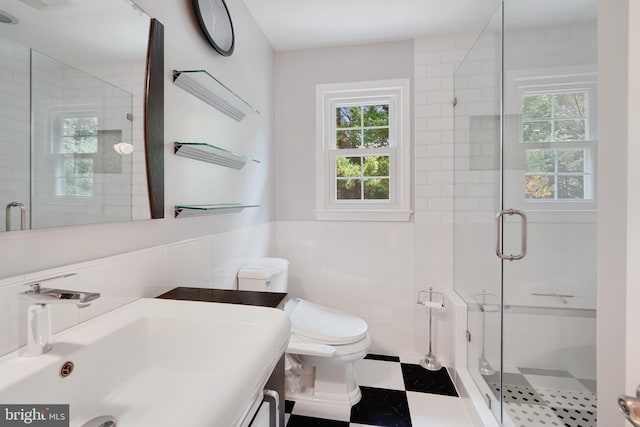 10401 Zion Dr, Fairfax, VA 22032 - bathroom featuring tile walls, toilet, a shower stall, vanity, and a wainscoted wall