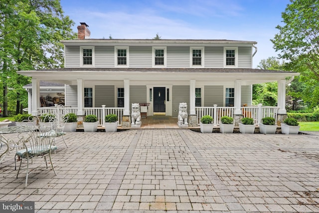 10401 Zion Dr, Fairfax, VA 22032 - country-style home with a porch and a chimney