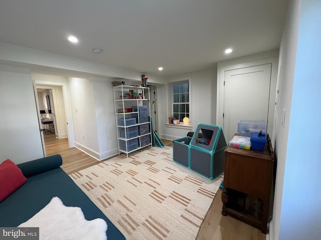 3200 Winnett Rd, Chevy Chase, MD 20815 - living area with wood finished floors, recessed lighting, and baseboards
