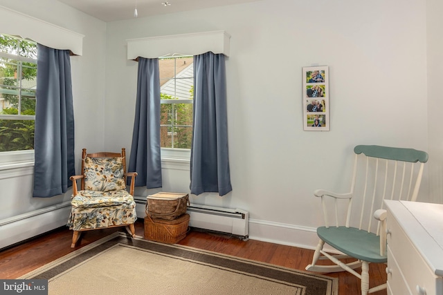 1110 Holland Ave, Cambridge, MD 21613 - living area featuring a baseboard radiator, wood finished floors, and baseboards
