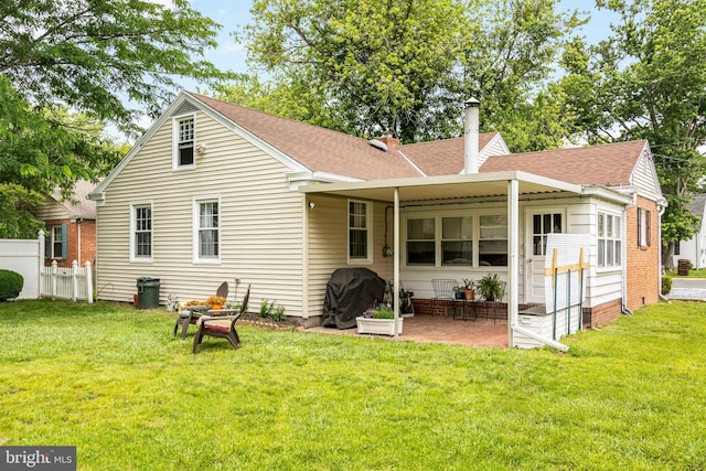 1110 Holland Ave, Cambridge, MD 21613 - back of house featuring roof with shingles, a chimney, and a patio