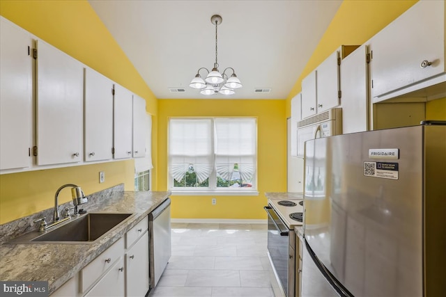 109 Water Fountain Way Unit 304, Glen Burnie, MD 21060 - kitchen with appliances with stainless steel finishes, a sink, white cabinets, baseboards, and lofted ceiling