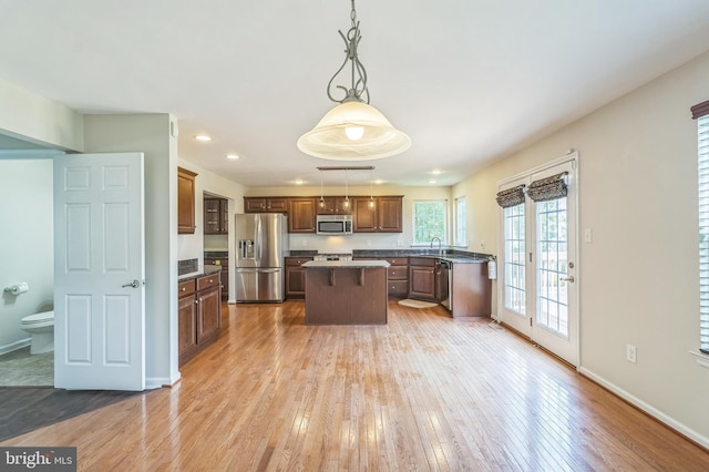 102 Helen Dr, Cinnaminson, NJ 08077 - kitchen featuring stainless steel appliances, a center island, recessed lighting, light wood-type flooring, and a sink