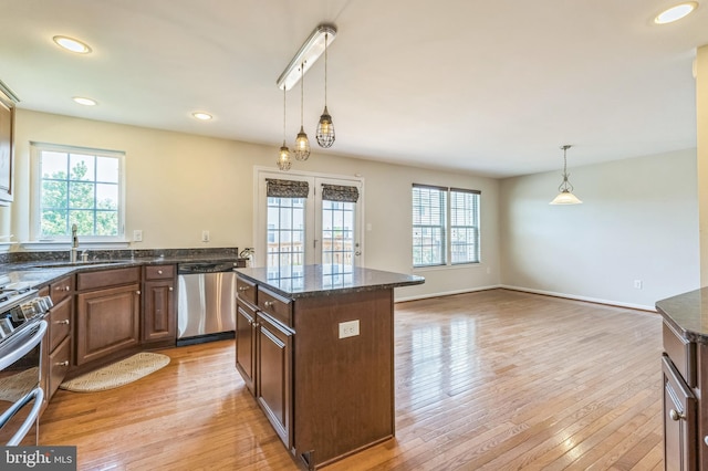 102 Helen Dr, Cinnaminson, NJ 08077 - kitchen featuring appliances with stainless steel finishes, healthy amount of natural light, a sink, dark stone countertops, and recessed lighting