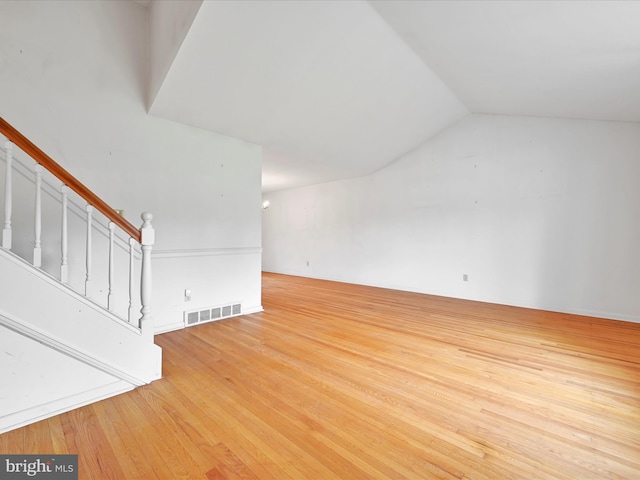 1122 Sheffield Dr, Berwyn, PA 19312 - unfurnished living room with light wood-type flooring, lofted ceiling, and stairway