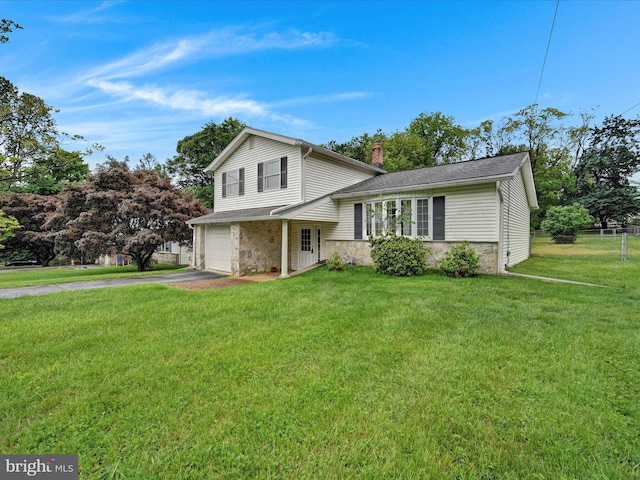 1122 Sheffield Dr, Berwyn, PA 19312 - tri-level home featuring stone siding, driveway, a chimney, and an attached garage
