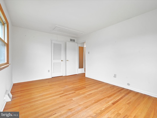 1122 Sheffield Dr, Berwyn, PA 19312 - spare room with attic access, light wood-style floors, and baseboards