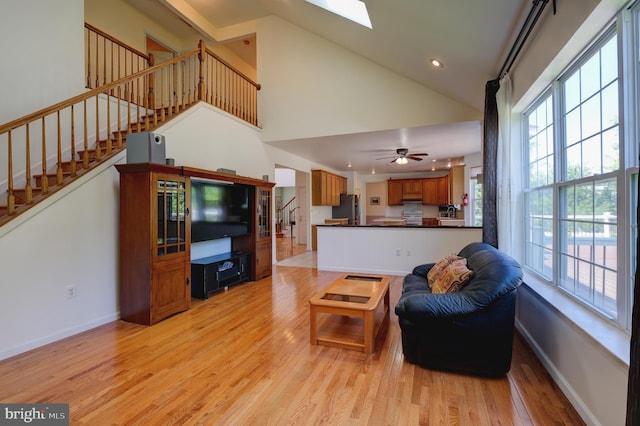 5 Pierce Rd, East Windsor, NJ 08520 - living room with stairs, light wood finished floors, baseboards, a skylight, and recessed lighting