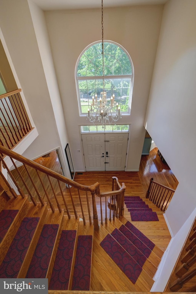 5 Pierce Rd, East Windsor, NJ 08520 - foyer entrance featuring a towering ceiling, a chandelier, wood finished floors, and stairway