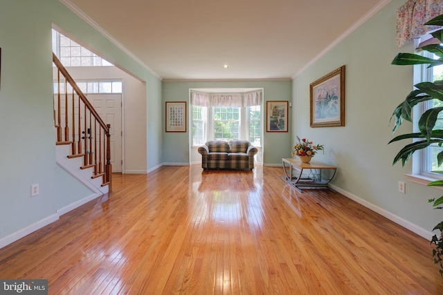 5 Pierce Rd, East Windsor, NJ 08520 - living area featuring light wood-style flooring, crown molding, stairway, and baseboards