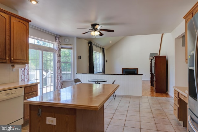 5 Pierce Rd, East Windsor, NJ 08520 - kitchen featuring dishwasher, a ceiling fan, a kitchen island, brown cabinetry, and lofted ceiling