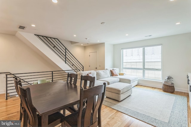 407 Salmon St, Philadelphia, PA 19125 - dining area with recessed lighting, light wood-style flooring, baseboards, and stairs