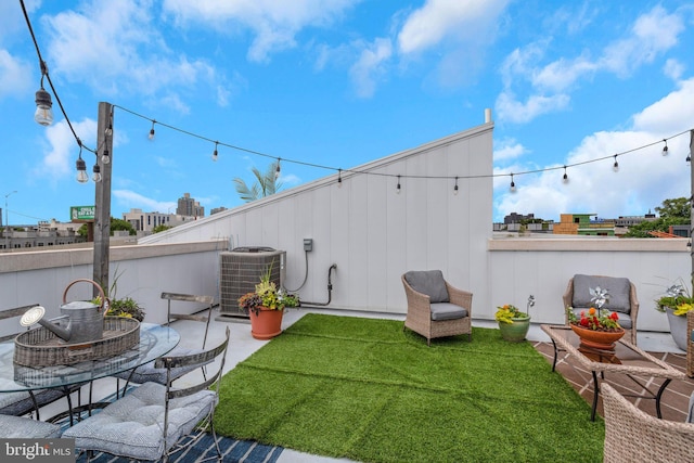 407 Salmon St, Philadelphia, PA 19125 - view of grassy yard featuring central AC unit and a patio area