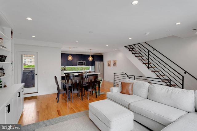 407 Salmon St, Philadelphia, PA 19125 - living room featuring recessed lighting, light wood-type flooring, stairs, and baseboards