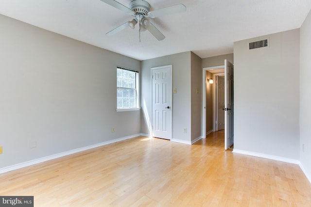 1525 Lincoln Way Unit 301A, Mclean, VA 22102 - unfurnished bedroom featuring light wood-type flooring, baseboards, a ceiling fan, and a closet