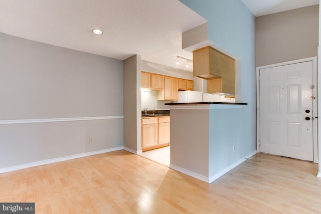 1525 Lincoln Way Unit 301A, Mclean, VA 22102 - kitchen with light brown cabinets, dark countertops, light wood finished floors, baseboards, and recessed lighting