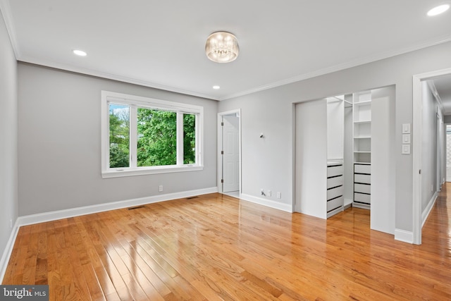 826 Suffolk Rd, Jenkintown, PA 19046 - unfurnished bedroom with ornamental molding, a walk in closet, light wood-type flooring, baseboards, and a closet