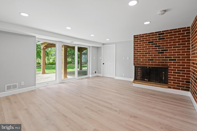 826 Suffolk Rd, Jenkintown, PA 19046 - unfurnished living room with a brick fireplace, wood finished floors, recessed lighting, and baseboards