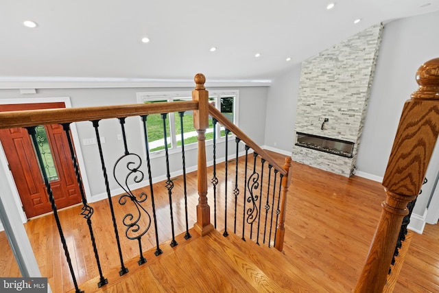 826 Suffolk Rd, Jenkintown, PA 19046 - stairway with a stone fireplace, lofted ceiling, wood finished floors, recessed lighting, and baseboards