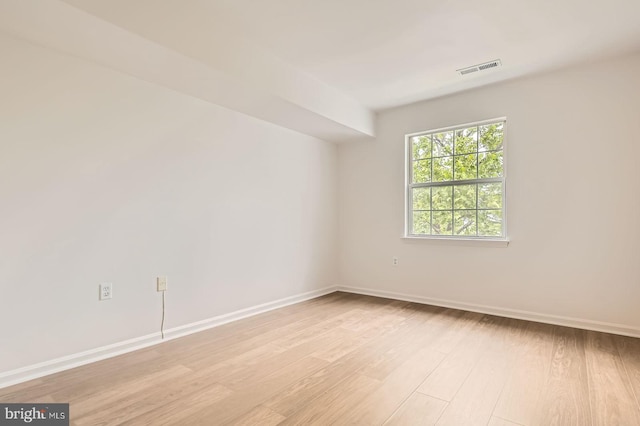 8385 Montgomery Run Rd Unit G, Ellicott City, MD 21043 - spare room featuring light wood-style flooring and baseboards