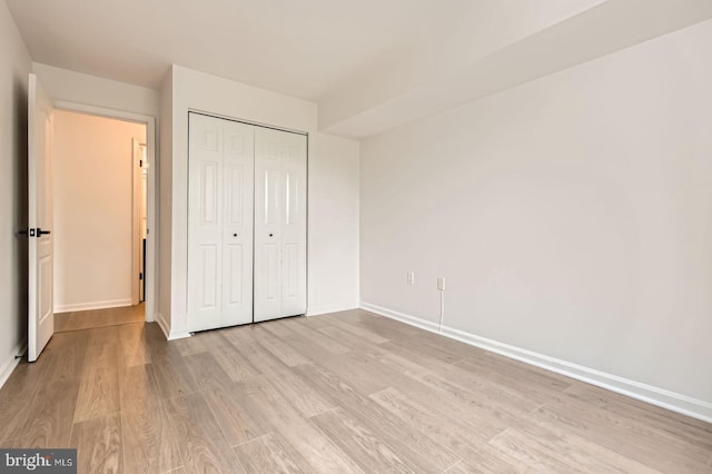 8385 Montgomery Run Rd Unit G, Ellicott City, MD 21043 - unfurnished bedroom featuring light wood-style floors, baseboards, and a closet