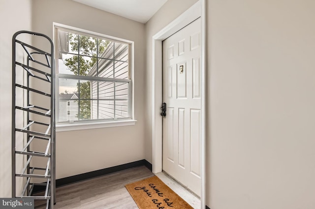 8385 Montgomery Run Rd Unit G, Ellicott City, MD 21043 - doorway with wood finished floors and baseboards