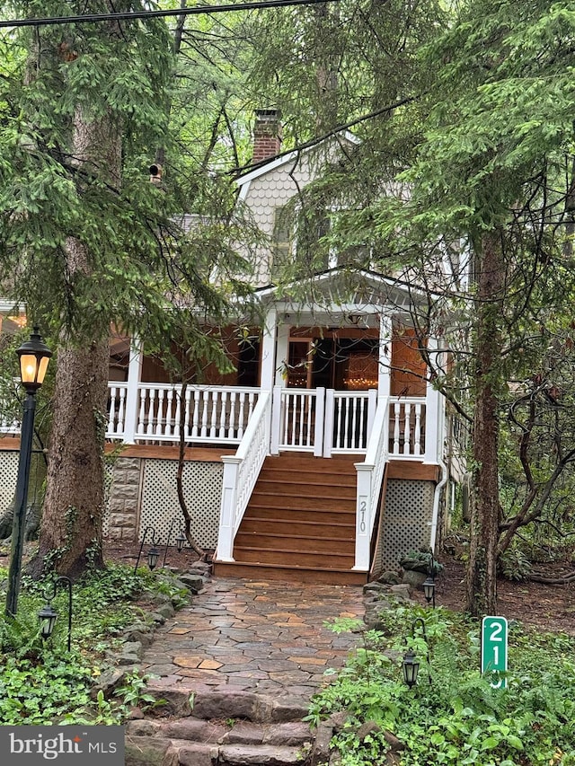210 Pennsylvania Ave, Mount Gretna, PA 17064 - view of front facade featuring stairway and a chimney