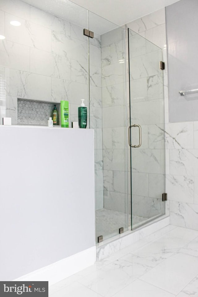 5E 27th St, Baltimore, MD 21218 - bathroom with a marble finish shower and marble finish flooring