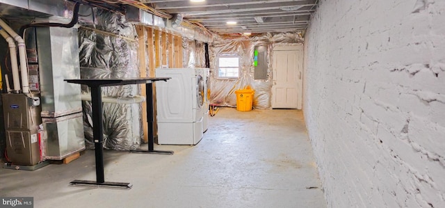 5E 27th St, Baltimore, MD 21218 - basement with electric panel, independent washer and dryer, and heating unit