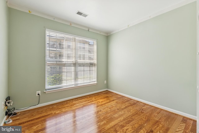 25272 Riffleford Sq Unit 104, Chantilly, VA 20152 - unfurnished room with wood finished floors, healthy amount of natural light, and baseboards