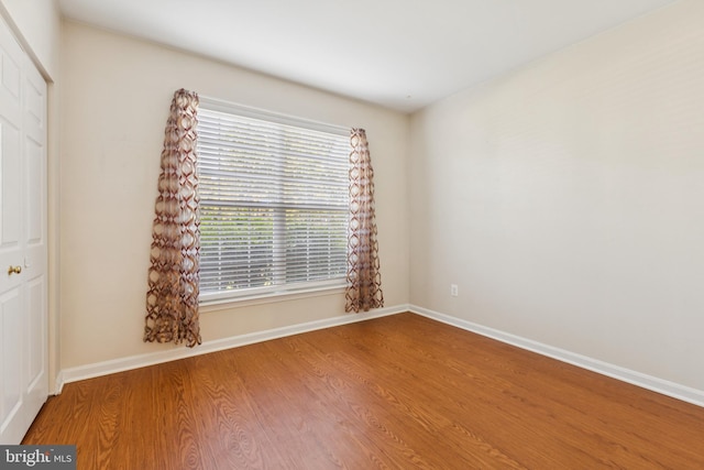 25272 Riffleford Sq Unit 104, Chantilly, VA 20152 - empty room with wood finished floors and baseboards
