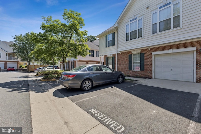 25272 Riffleford Sq Unit 104, Chantilly, VA 20152 - view of front facade with brick siding