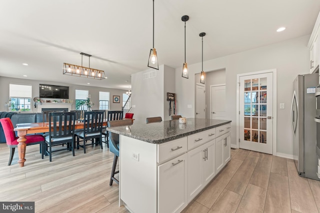 2042 Morgan Creek Dr, Quakertown, PA 18951 - kitchen with freestanding refrigerator, light wood-style floors, open floor plan, white cabinets, and recessed lighting