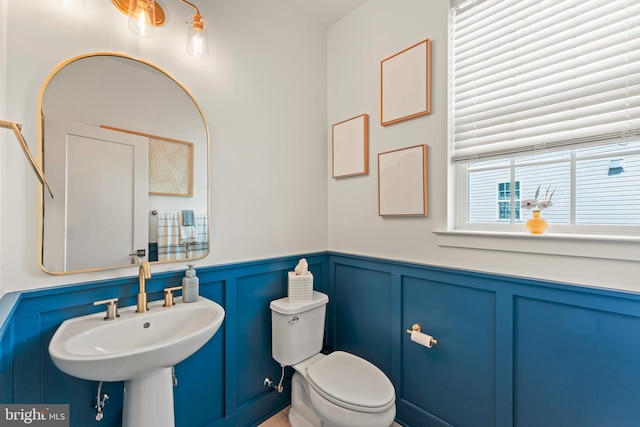 2042 Morgan Creek Dr, Quakertown, PA 18951 - half bath with a decorative wall, toilet, a wainscoted wall, and a sink