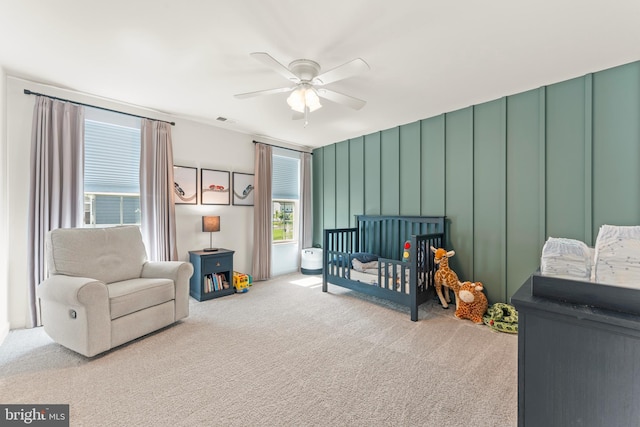 2042 Morgan Creek Dr, Quakertown, PA 18951 - bedroom featuring carpet flooring, a crib, ceiling fan, and a decorative wall