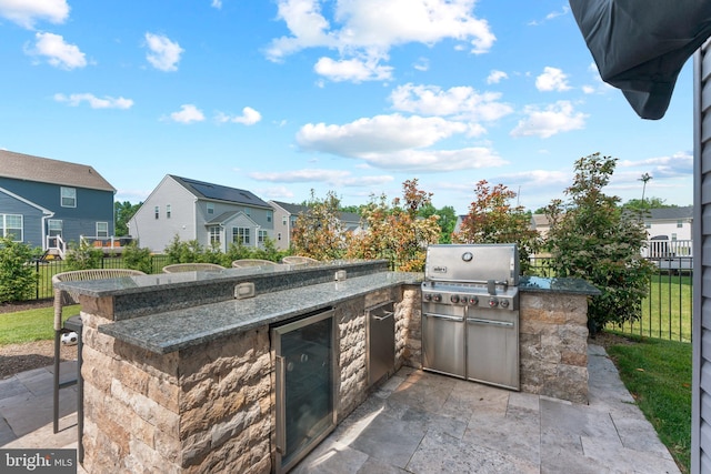 2042 Morgan Creek Dr, Quakertown, PA 18951 - view of patio featuring beverage cooler, a residential view, and an outdoor kitchen