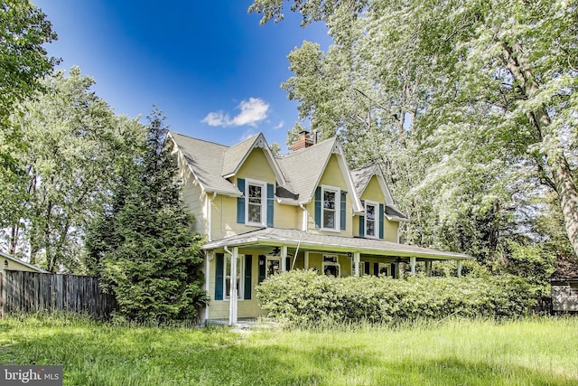 9112 3rd St, Lanham, MD 20706 - view of front of house featuring a porch, a chimney, and roof with shingles