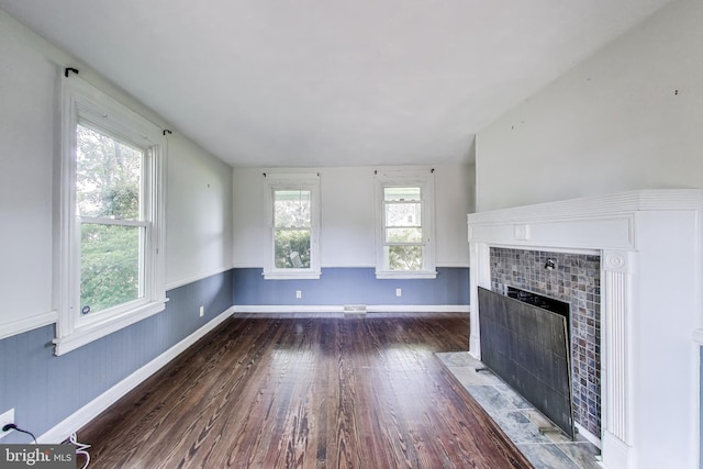 9112 3rd St, Lanham, MD 20706 - unfurnished living room with a tile fireplace, wood finished floors, and baseboards