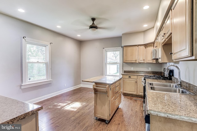 9112 3rd St, Lanham, MD 20706 - kitchen with a sink, a ceiling fan, wood finished floors, a kitchen island, and recessed lighting