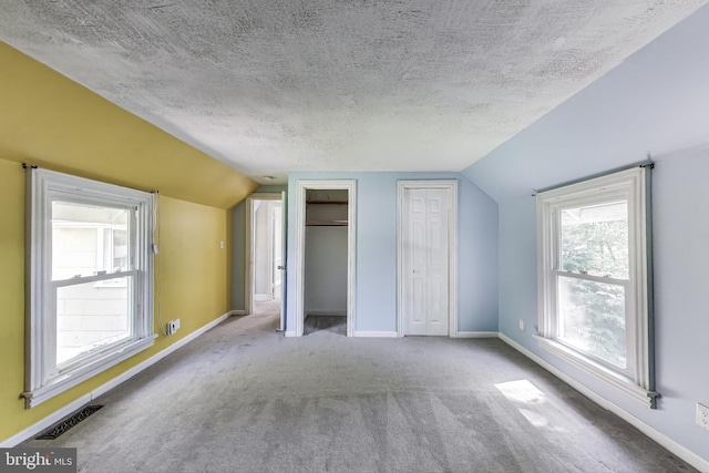 9112 3rd St, Lanham, MD 20706 - additional living space featuring vaulted ceiling, carpet, baseboards, and a textured ceiling