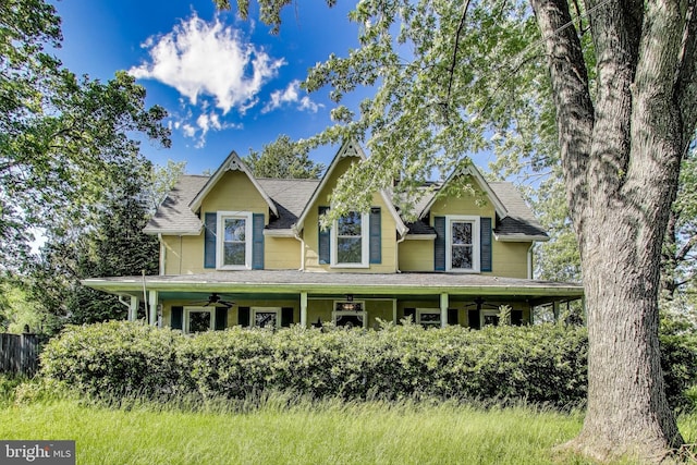 9112 3rd St, Lanham, MD 20706 - victorian house with ceiling fan, a shingled roof, and covered porch